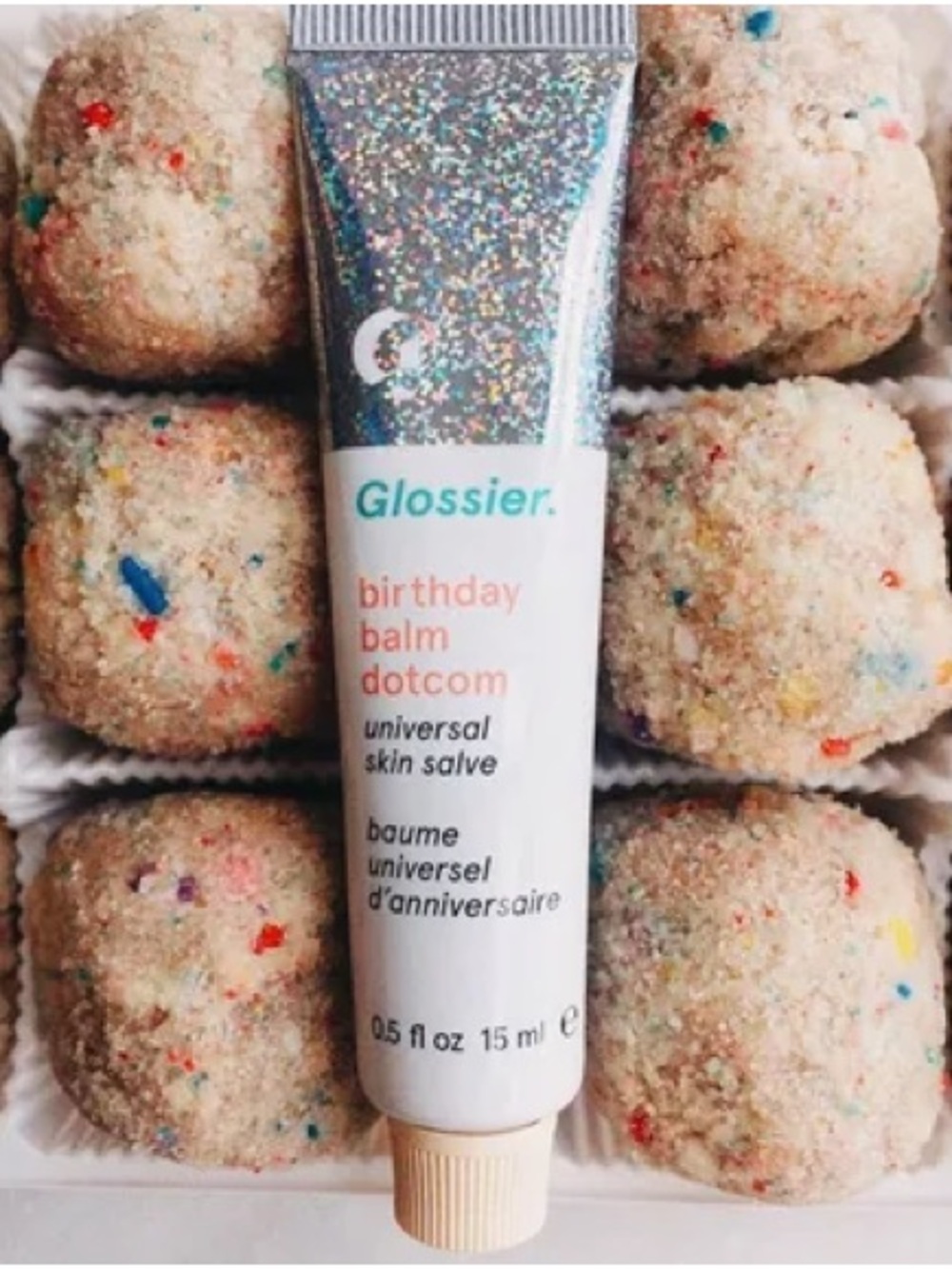 Glossier Birthday Balm Dotcom — White tube with silver glitter cap